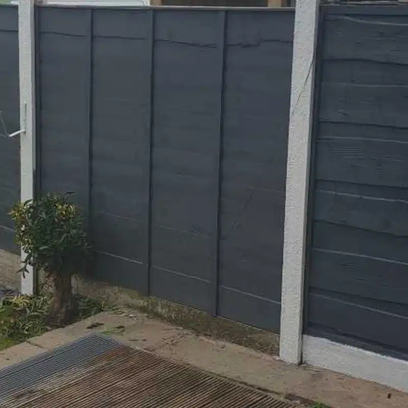 A fence painted in slate grey