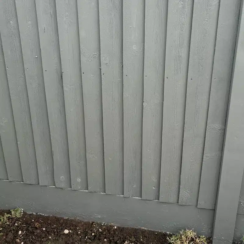 A fence painted in basalt grey