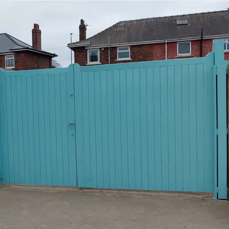 A fence painted in porcelain blue